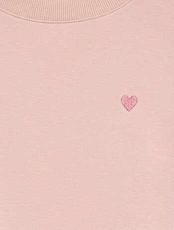 Sweater van joggingstof met borduursel en fronsjes op de schouder