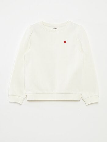 Sweater van joggingstof met borduursel en fronsjes op de schouder