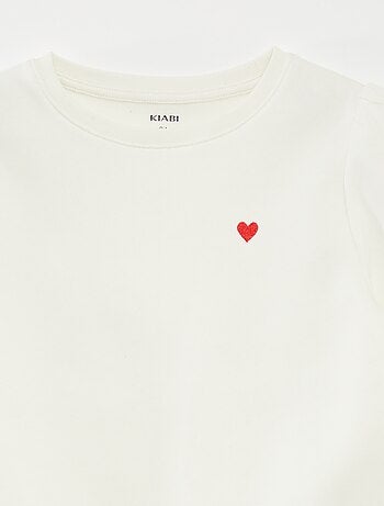 Sweater van joggingstof met borduursel en fronsjes op de schouder