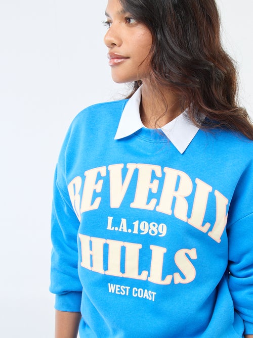 Sweater van joggingstof met opschrift - Kiabi Sweater van joggingstof met opschrift - Kiabi