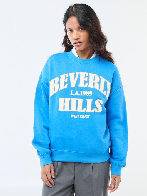 Sweater van joggingstof met opschrift - Kiabi Sweater van joggingstof met opschrift - Kiabi