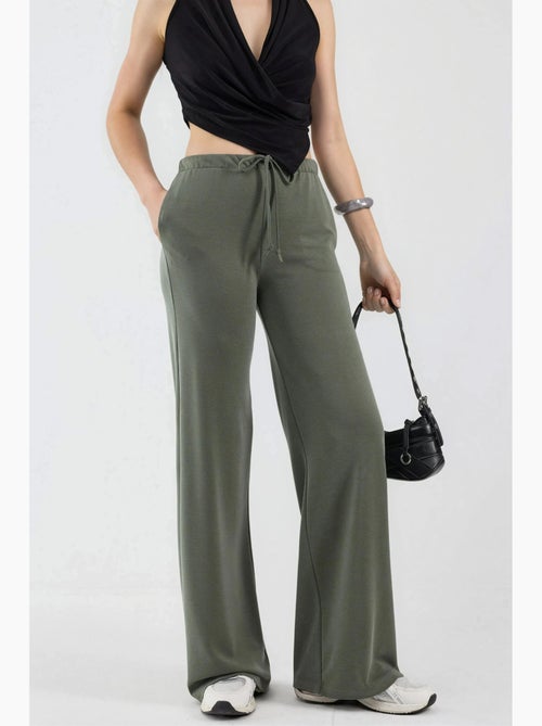 Sweatpants met wijde pijpen en taille met trekkoord busem - Kiabi Sweatpants met wijde pijpen en taille met trekkoord busem - Kiabi