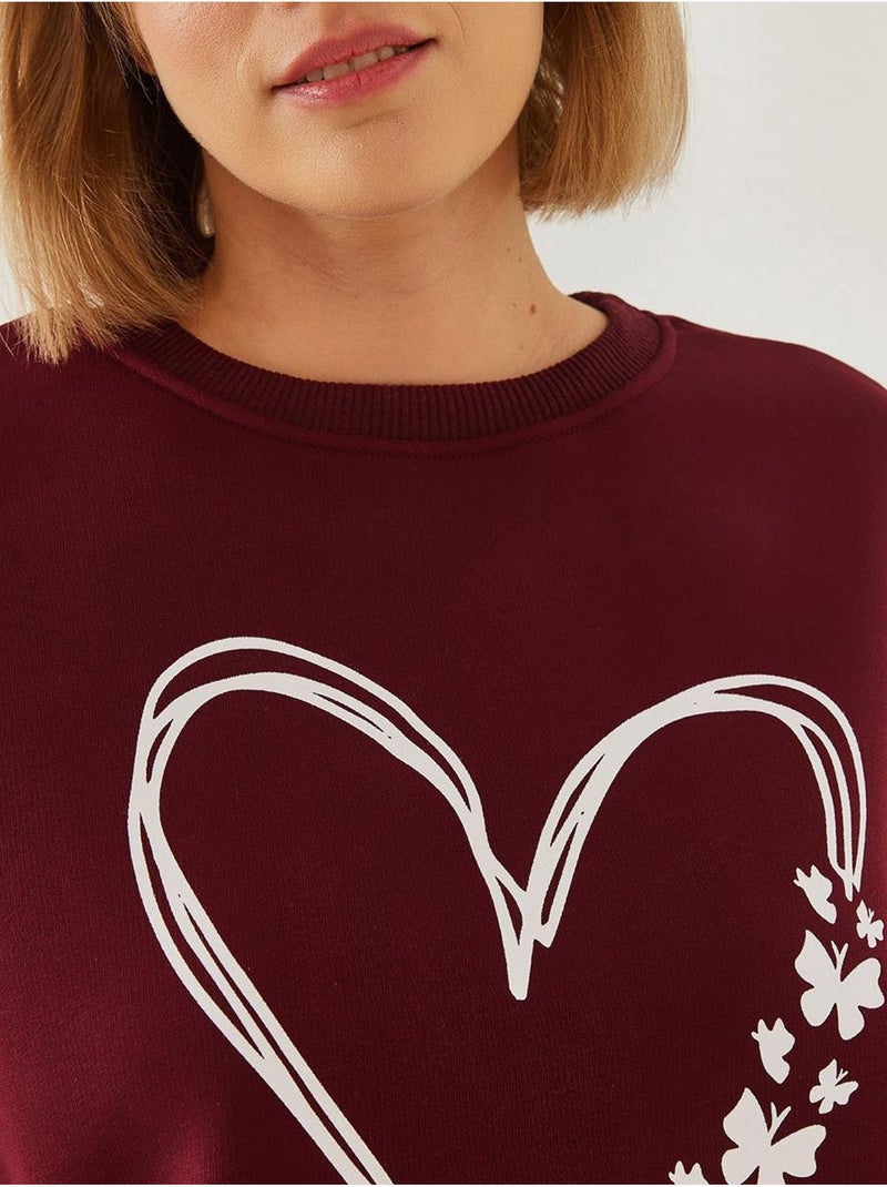 Sweatshirt met ronde hals en geborsteld garen met hartjesprint lucci Bordeauxrood - Kiabi