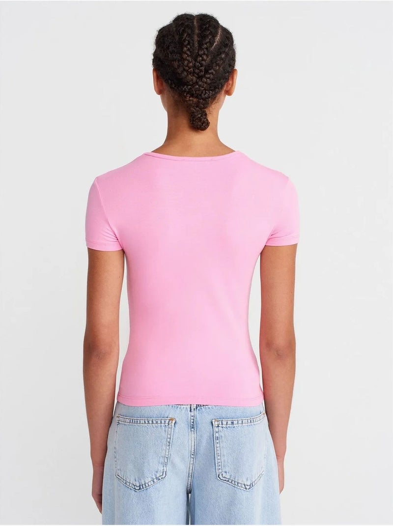 T-shirt court femme, coupe ajustée, col rond dilvin Rose fluo/Solinotes - Kiabi