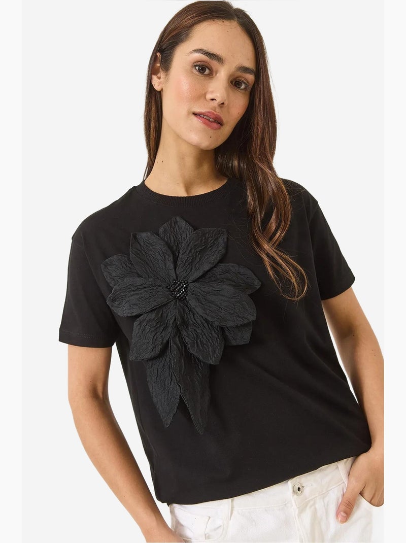 T-shirt en coton à manches courtes avec accessoire floral lucci Noir - Kiabi