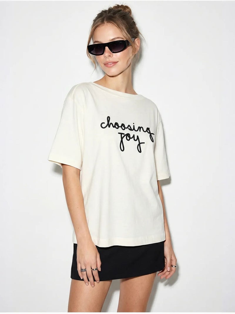T-shirt femme en coton à col bateau et imprimé lucci Blanc cassé - Kiabi