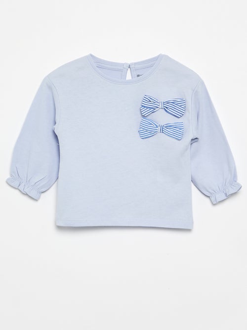 T-shirt met decoratieve strikjes en lange mouwen - Kiabi T-shirt met decoratieve strikjes en lange mouwen - Kiabi
