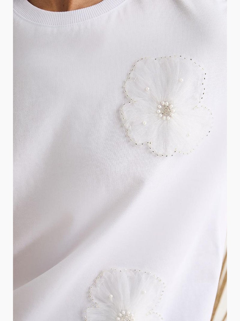 T-shirt met ronde hals en korte mouwen en bloemenaccessoire lucci Wit - Kiabi