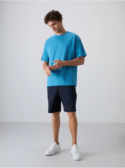 T-shirt oversize en mélange coton à col rond tommy - Kiabi T-shirt oversize en mélange coton à col rond tommy - Kiabi