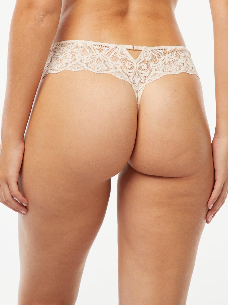 Tanga en dentelle transparente avec bijou fantaisie Crème - Kiabi