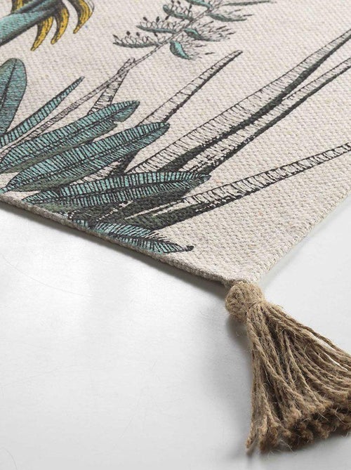 Tapijt met een print van exotische bladeren en pompons - Kiabi