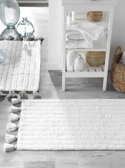 Tapis de bain uni et à pompons - Kiabi Tapis de bain uni et à pompons - Kiabi