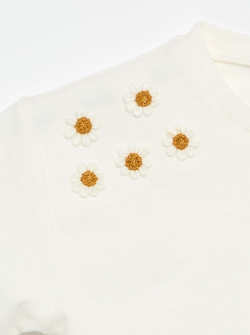 Tee-shirt à manches courtes avec fleurs sur l'épaule - Kiabi Tee-shirt à manches courtes avec fleurs sur l'épaule - Kiabi
