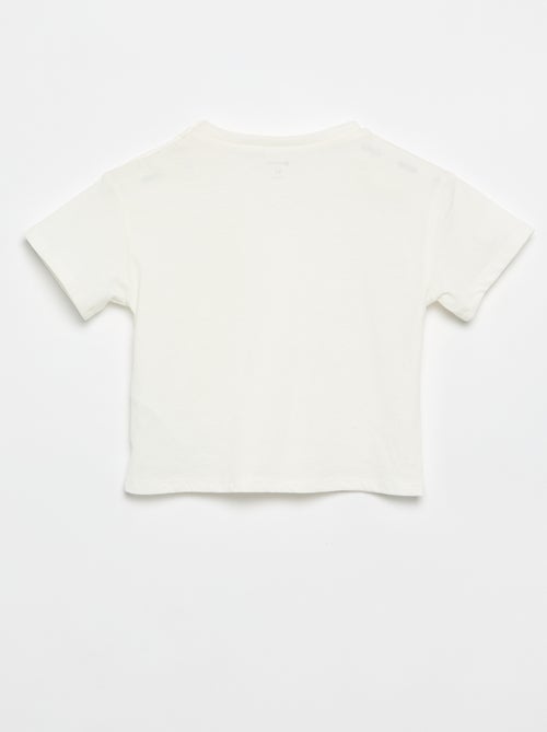 Tee-shirt à manches courtes avec fleurs sur l'épaule - Kiabi Tee-shirt à manches courtes avec fleurs sur l'épaule - Kiabi