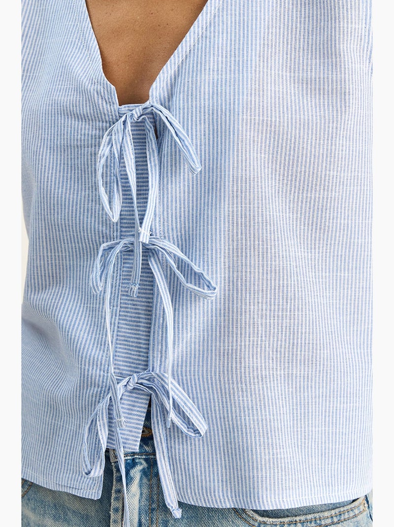 Top gestreept v-hals met strikdetail lucci Pastelblauw - Kiabi