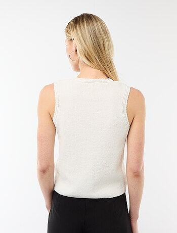 Top sans manches avec boutons dorés