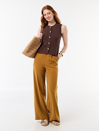 Top sans manches avec boutons dorés