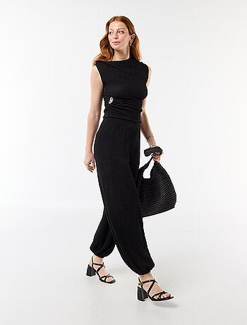 Top stretch uni asymétrique sans manches