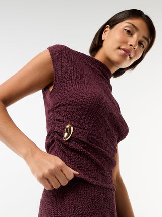 Top stretch uni asymétrique sans manches