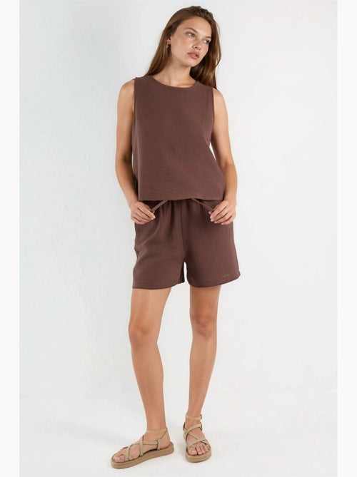 Tweedelig set met mouwloze mousseline top en short hiccup - Kiabi Tweedelig set met mouwloze mousseline top en short hiccup - Kiabi