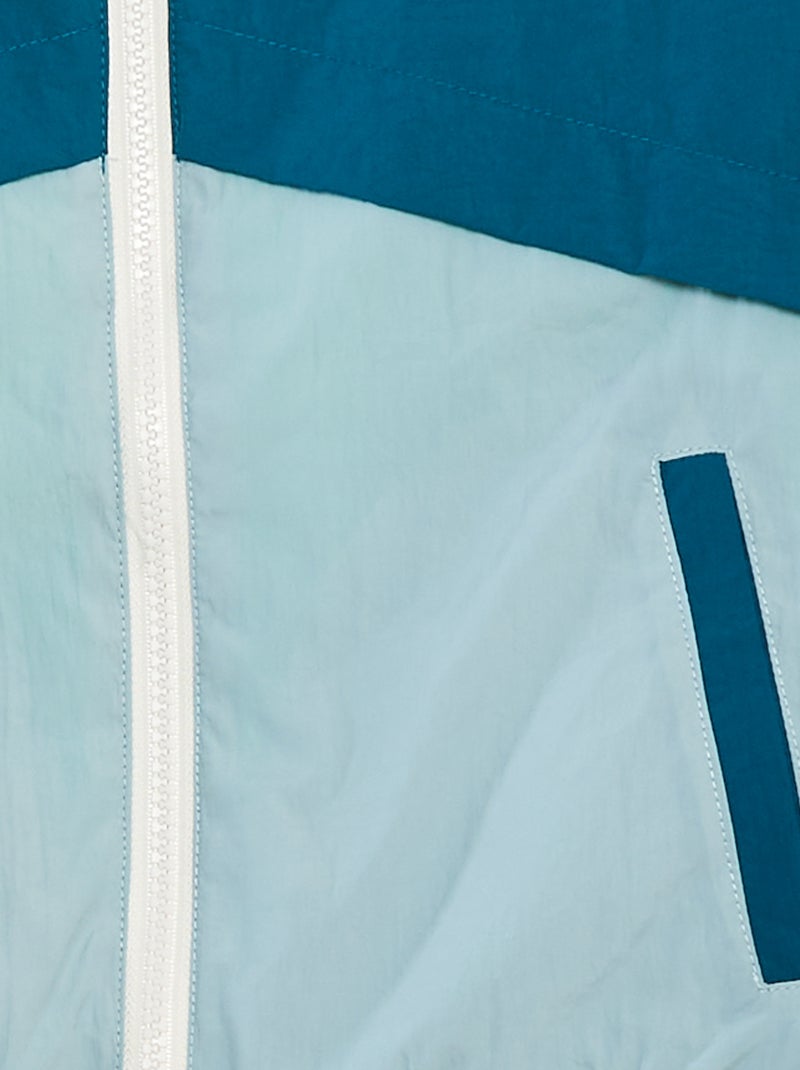 Tweekleurig, omkeerbaar windjack BLAUW - Kiabi