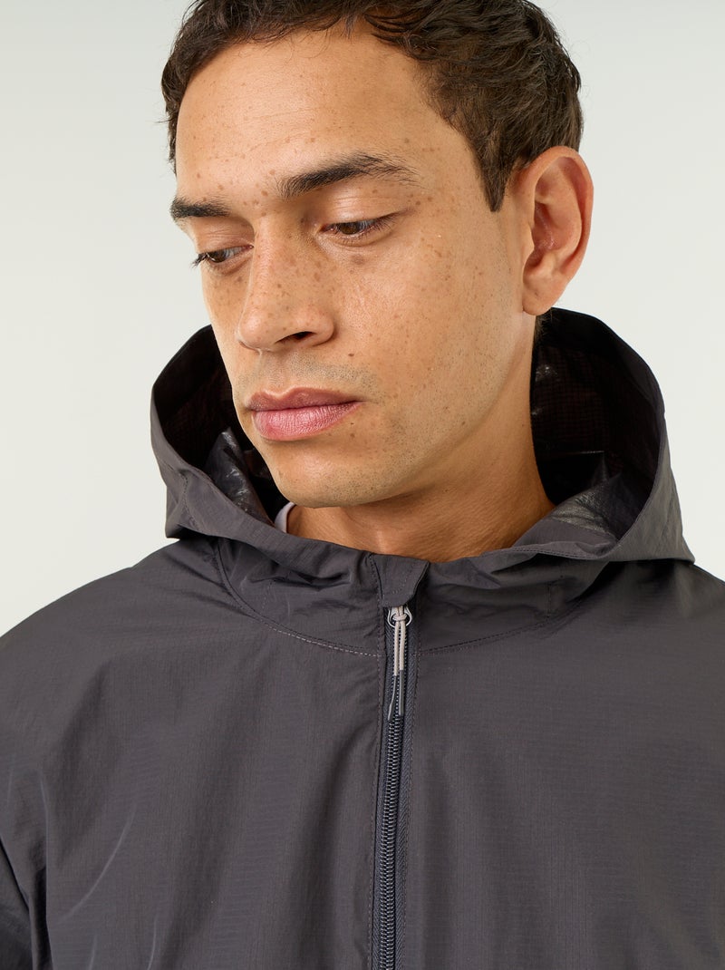 Waterafstotend windjack met capuchon Zwart - Kiabi