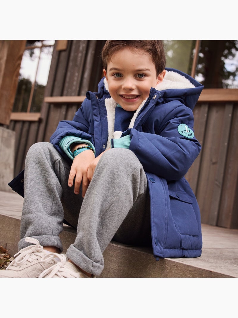 Waterdichte kinderjas met sherpa-voering en capuchon, model Oscar Blauw - Kiabi