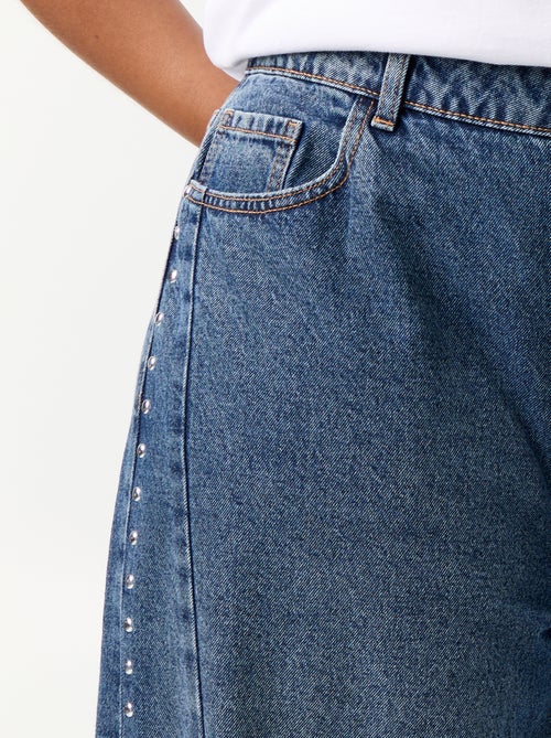 Wide leg jeans met fantasie uitsnijdingen en studs - Kiabi Wide leg jeans met fantasie uitsnijdingen en studs - Kiabi