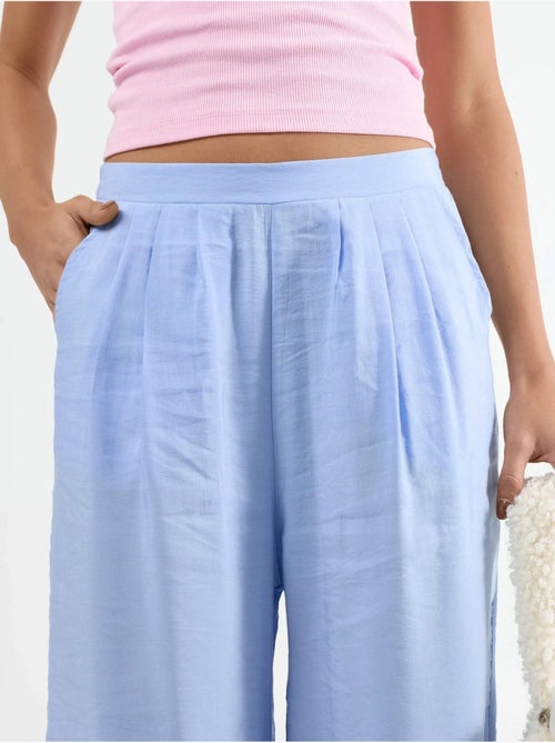 Wijde broek met plooien busem - Kiabi Wijde broek met plooien busem - Kiabi