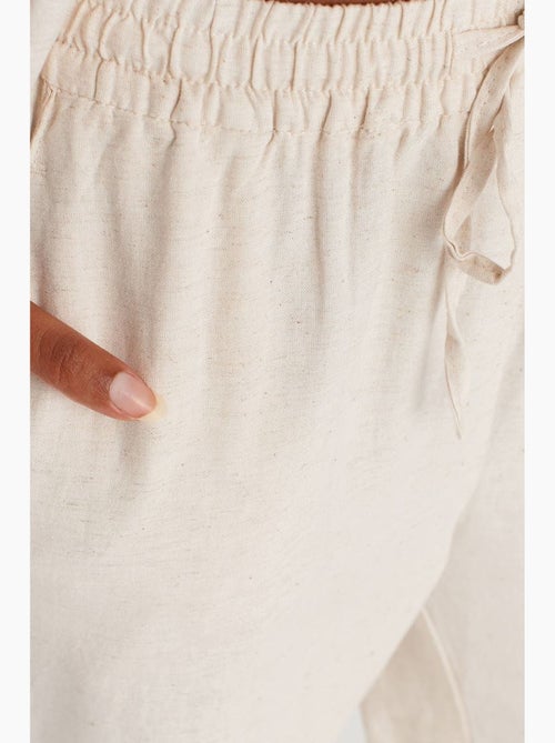 Wijde broek met trekkoord in de taille dilvin - Kiabi Wijde broek met trekkoord in de taille dilvin - Kiabi