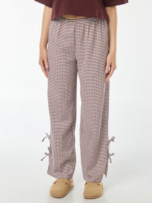 Wijde broek van gekreukte stof met strikjes - Kiabi