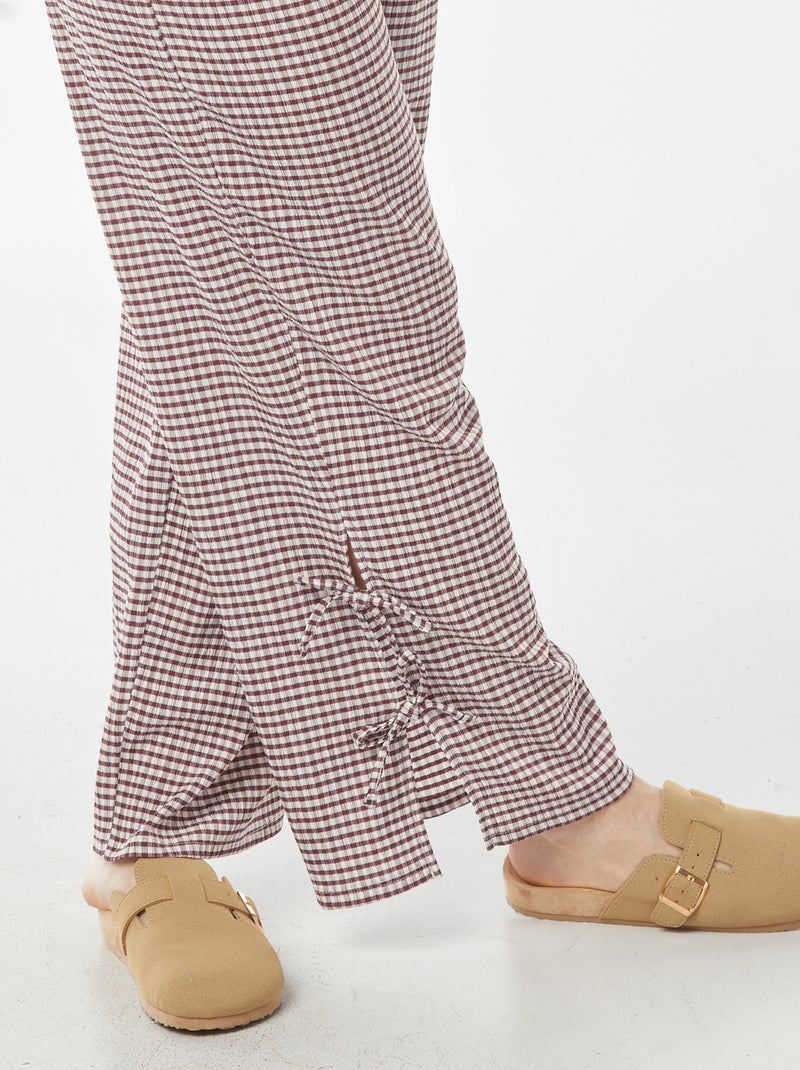 Wijde broek van gekreukte stof met strikjes Rood - Kiabi