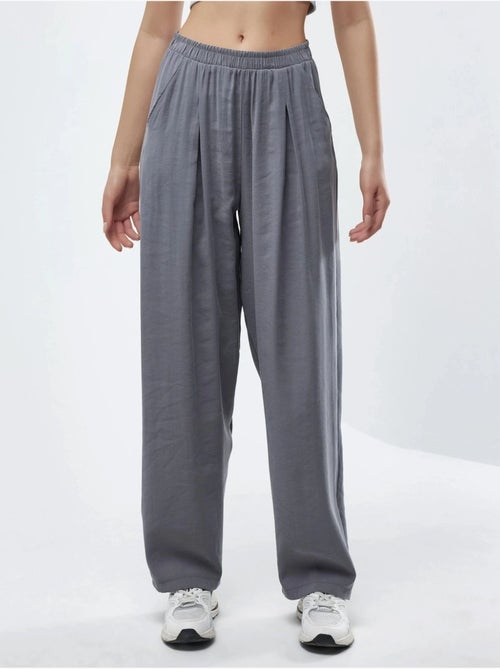 Wijde geplooide broek busem - Kiabi Wijde geplooide broek busem - Kiabi