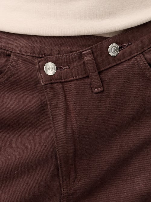 Wijde jeans met asymmetrische knoopsluiting - Kiabi Wijde jeans met asymmetrische knoopsluiting - Kiabi