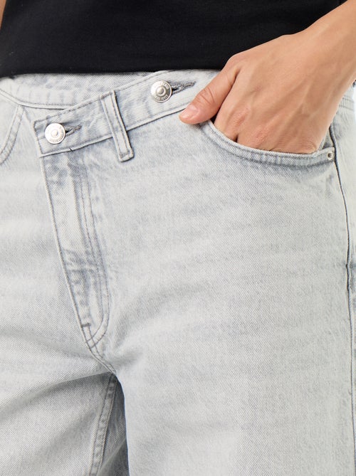 Wijde jeans met asymmetrische knoopsluiting - Kiabi Wijde jeans met asymmetrische knoopsluiting - Kiabi