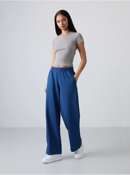 Wijde joggingbroek met hoge taille tommy - Kiabi Wijde joggingbroek met hoge taille tommy - Kiabi