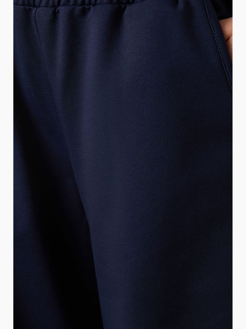 Wijde joggingbroek met hoge taille tommy - Kiabi Wijde joggingbroek met hoge taille tommy - Kiabi