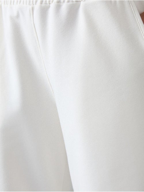 Wijde joggingbroek met hoge taille tommy - Kiabi Wijde joggingbroek met hoge taille tommy - Kiabi