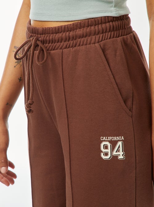 Wijde joggingbroek met sportswear-print - Kiabi