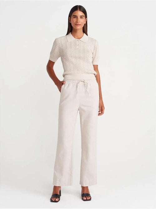 Wijde tencel broek met trekkoord in de taille dilvin - Kiabi Wijde tencel broek met trekkoord in de taille dilvin - Kiabi