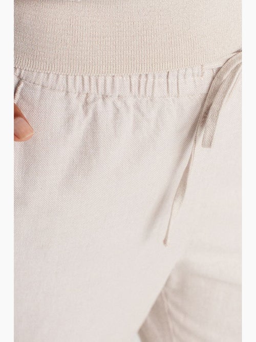 Wijde tencel broek met trekkoord in de taille dilvin - Kiabi Wijde tencel broek met trekkoord in de taille dilvin - Kiabi