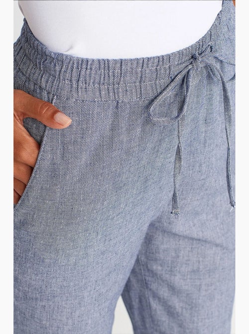 Wijde tencel broek met trekkoord in de taille dilvin - Kiabi Wijde tencel broek met trekkoord in de taille dilvin - Kiabi