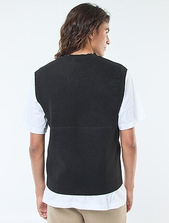 Mouwloze, gebreide trui met V-hals