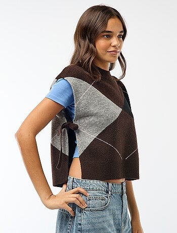 Mouwloze trui met knooplintjes aan weerszijden