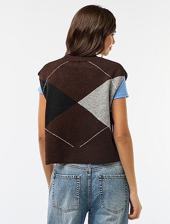 Mouwloze trui met knooplintjes aan weerszijden