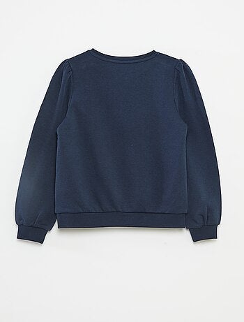 Sweater van joggingstof met borduursel en fronsjes op de schouder