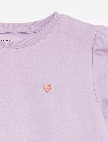 Sweater van joggingstof met borduursel en fronsjes op de schouder