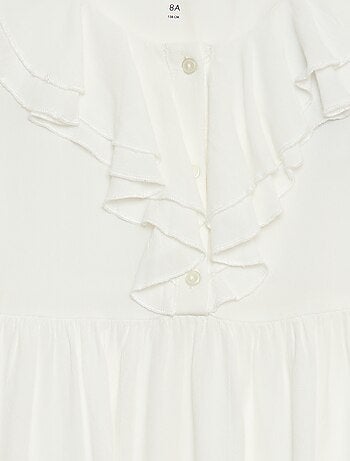 Top van licht tricot met motiefje